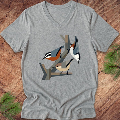 Gray v-neck t-shirt with nuthatch bird design on a wooden surface