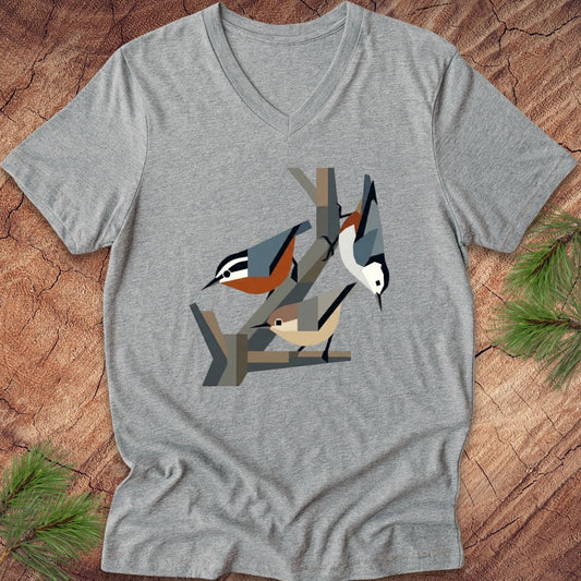 Gray v-neck t-shirt with nuthatch bird design on a wooden surface