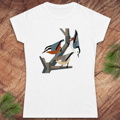 White t-shirt with nuthatch bird design on a wooden surface