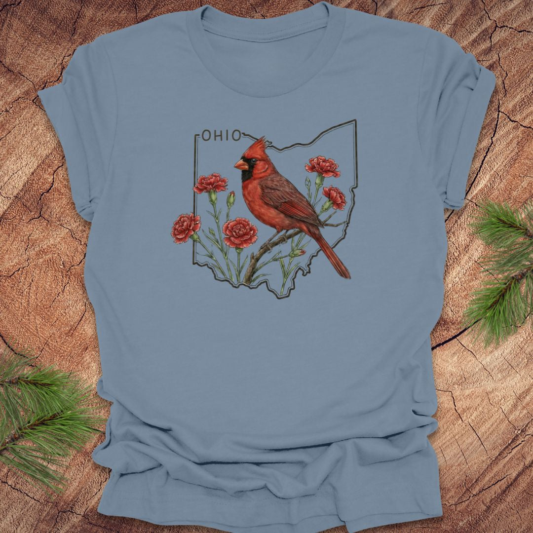 Steel blue t-shirt with a cardinal and floral design on an Ohio map, placed on a wooden surface.