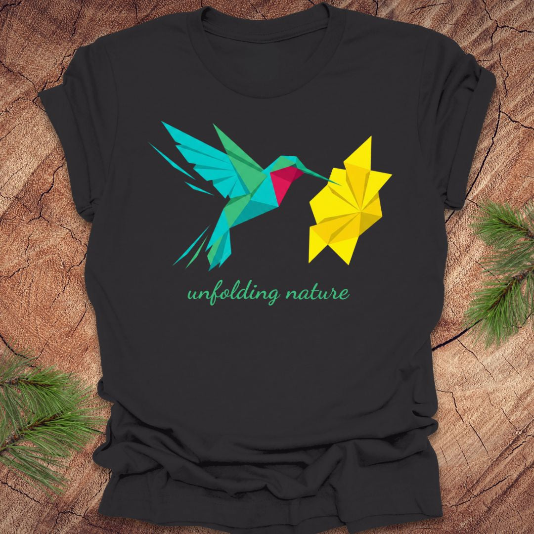 Dark gray t-shirt with a colorful hummingbird and yellow flower design on a wooden surface.