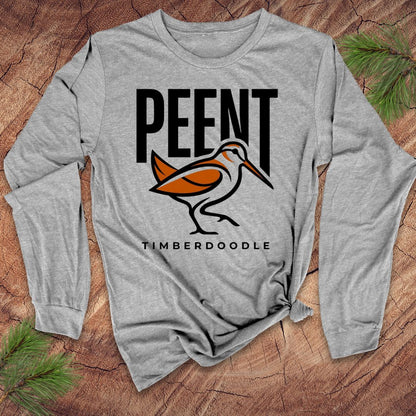 Gray long-sleeve shirt with 'PEENT TIMBERDOODLE' design on a wooden surface
