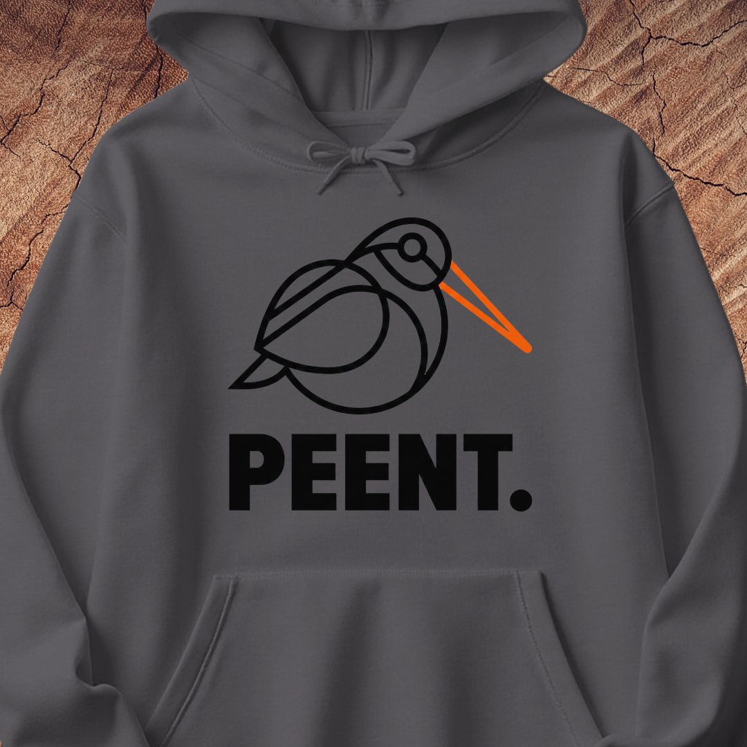 A dark gray pullover hoodie with a graphic of a black line-drawn bird with an orange beak and the word 'PEENT.' printed below in bold black letters, displayed against a textured wood background.
