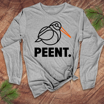 Gray long-sleeve shirt with 'PEENT.' woodcock design on a wooden surface