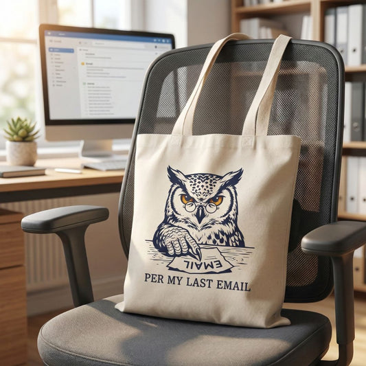 Tote bag with owl design and text on a chair in an office setting