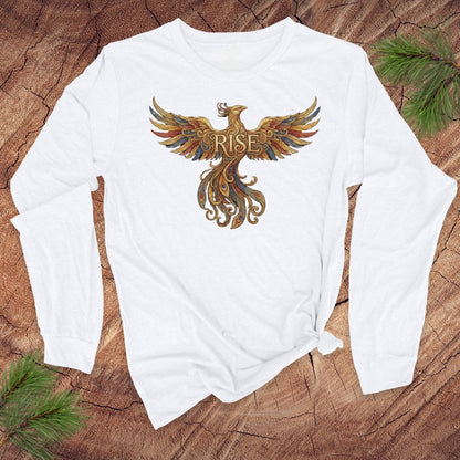 White long-sleeve shirt with a colorful phoenix design and 'RISE' text on a wooden surface.