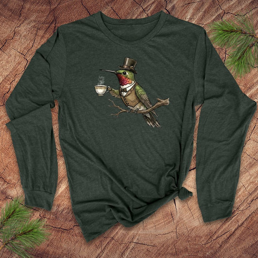 Forest green long-sleeve shirt with a vintage hummingbird with top hat and tea design on a wooden surface.