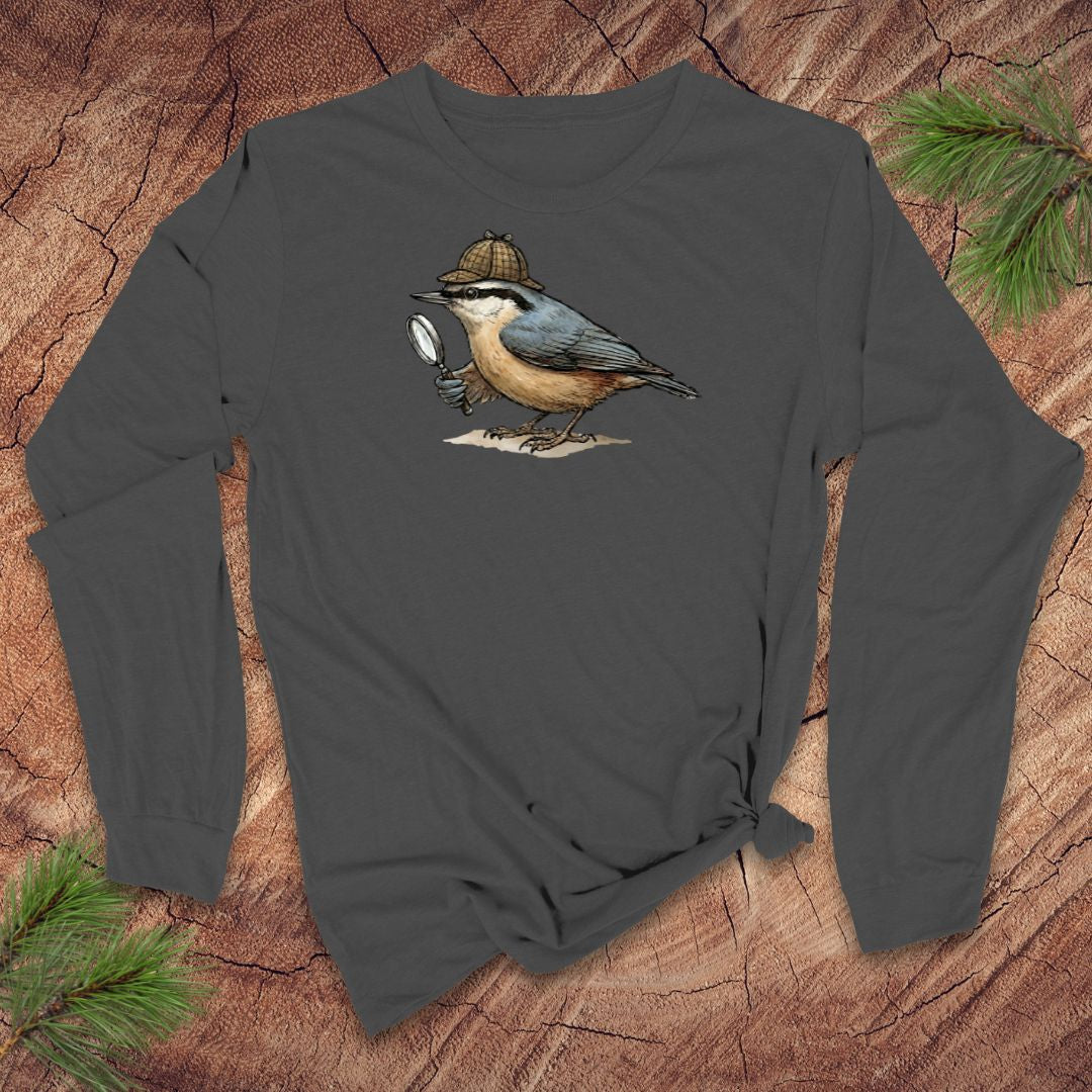 Grey long-sleeve shirt with a nuthatch bird with a Sherlock Holmes hat and magnifying glass graphic on a wooden surface
