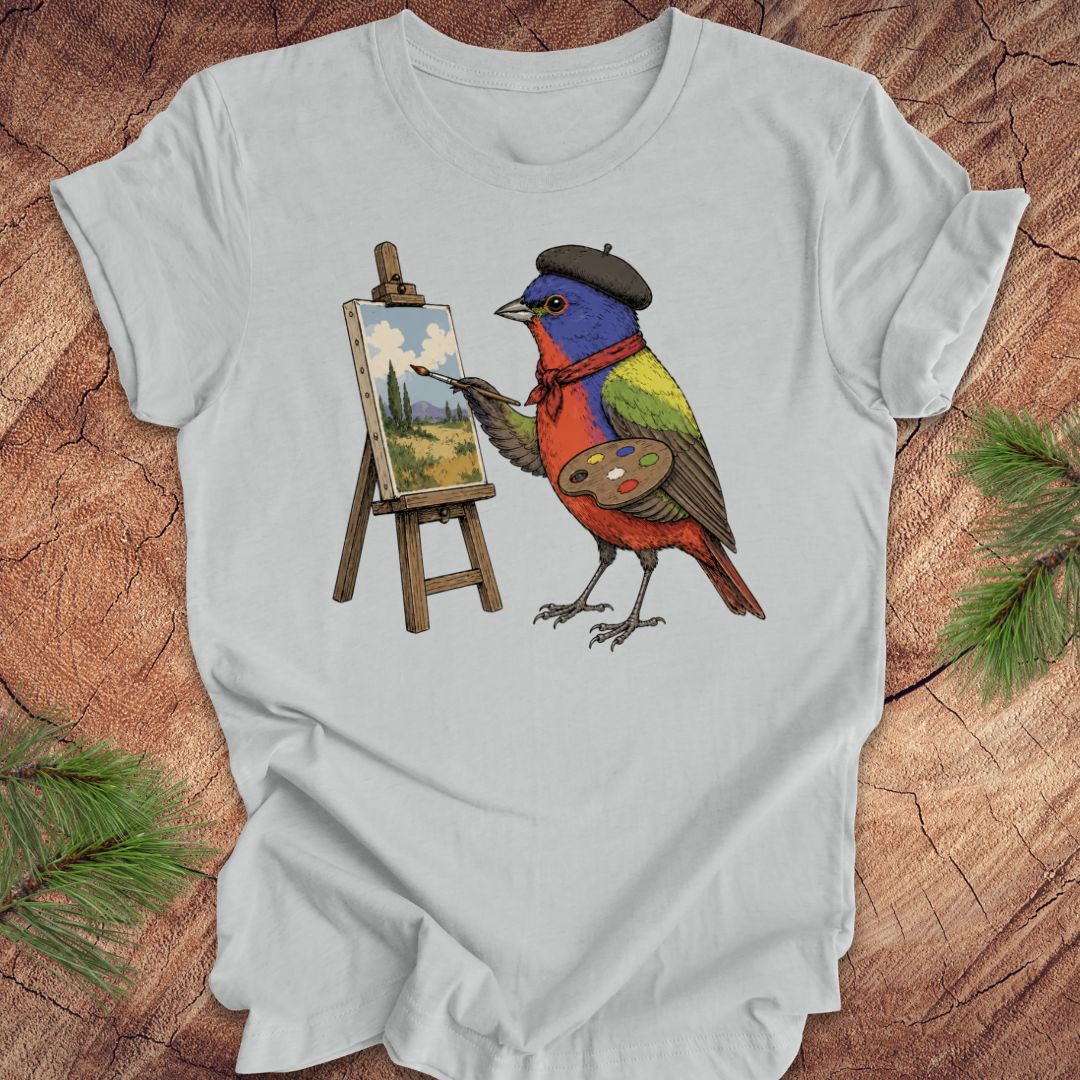Gray t-shirt with a painted bunting bird painting on a wooden surface