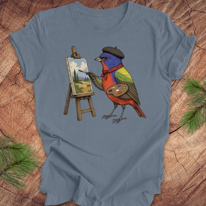 Steel blue t-shirt with a painted bunting bird painting on a wooden surface