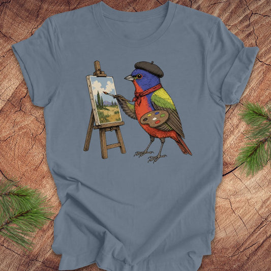 Steel blue t-shirt with a painted bunting bird painting on a wooden surface