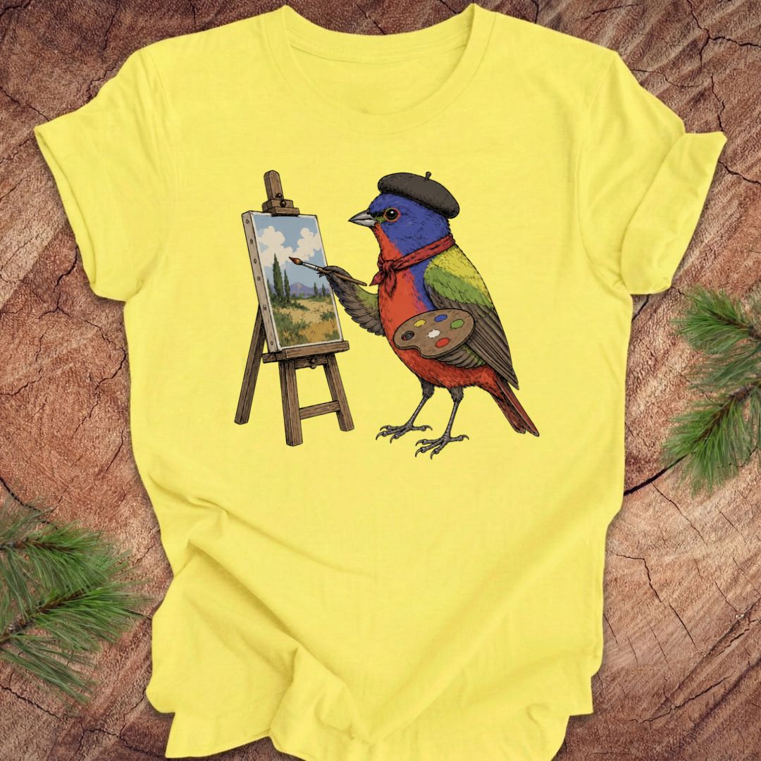 Yellow t-shirt with a painted bunting bird painting on a wooden surface