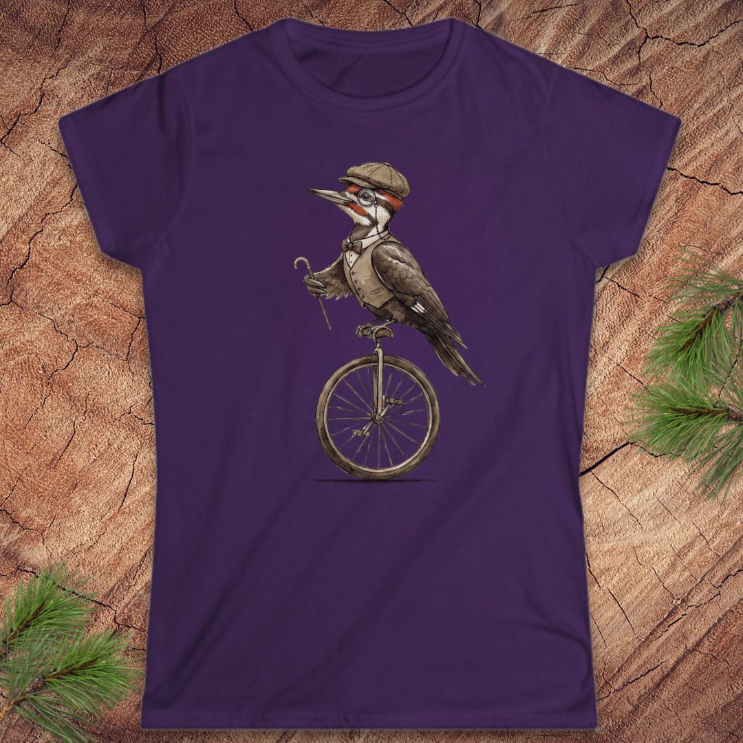 Purple t-shirt with a woodpecker design on a wooden surface