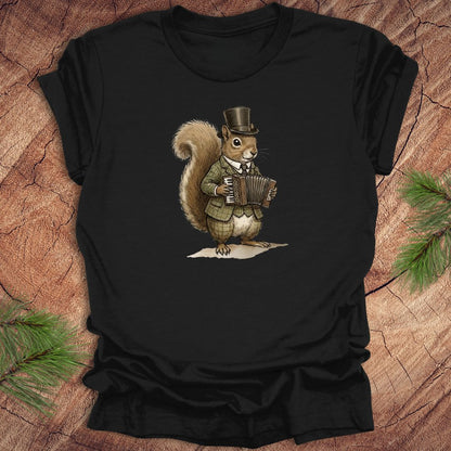 Black t-shirt with a well dressed squirrel playing an accordion graphic on a wooden surface.