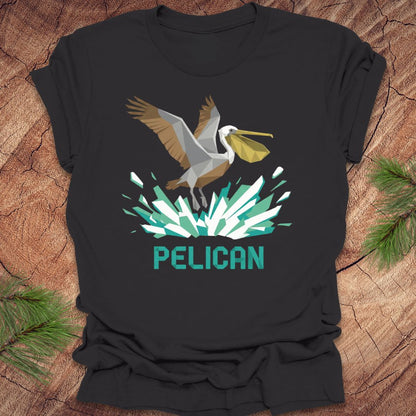 Dark gray t-shirt with a pelican graphic and 'PELICAN' text on a wooden surface.