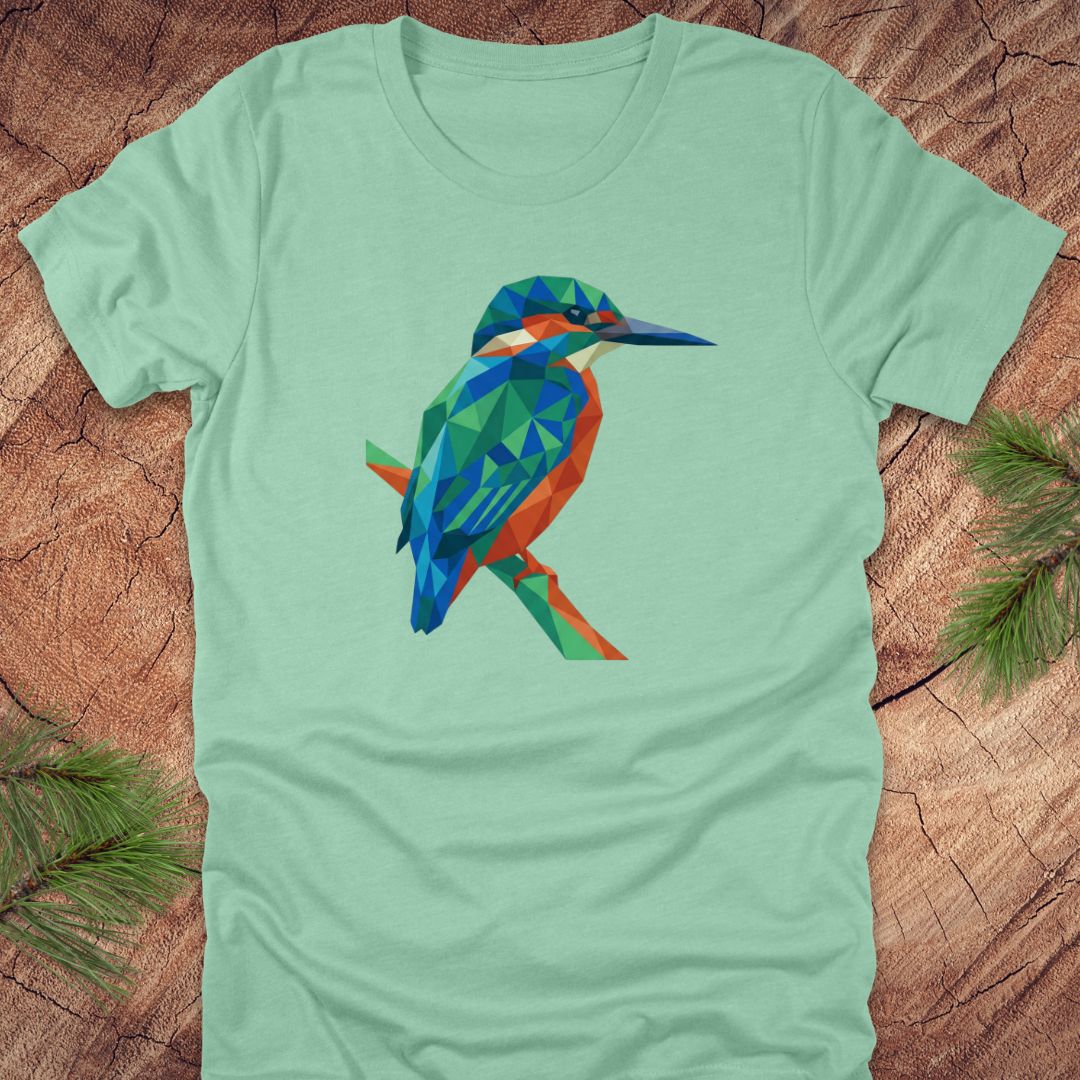 Light green t-shirt with a colorful kingfisher design on a wooden surface.