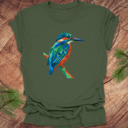 Green t-shirt with a colorful geometric kingfisher design on a wooden surface.