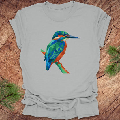 Gray t-shirt with a colorful kingfisher design on a wooden surface.