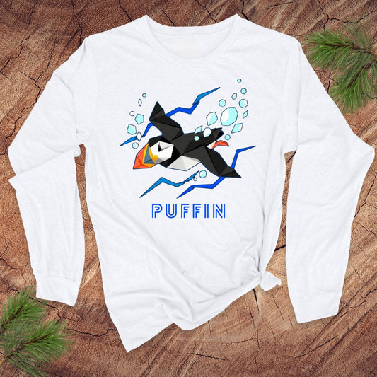 White long-sleeve shirt with a puffin graphic and 'PUFFIN' text on a wooden surface.