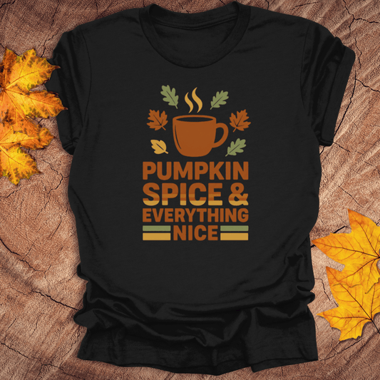 Black t-shirt with 'Pumpkin Spice & Everything Nice' design on a wooden surface with fall leaves.