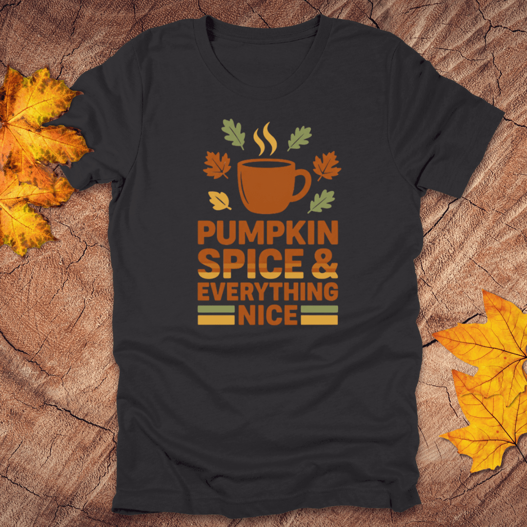 Black t-shirt with pumpkin spice and everything nice design on a wooden surface with fall leaves.