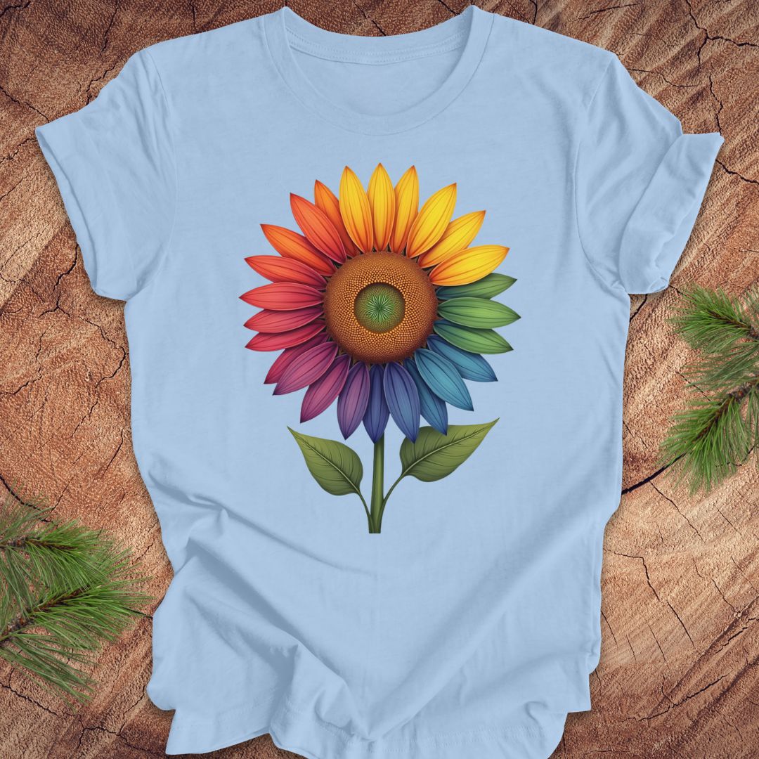 Light blue t-shirt with a colorful sunflower design on a wooden surface.
