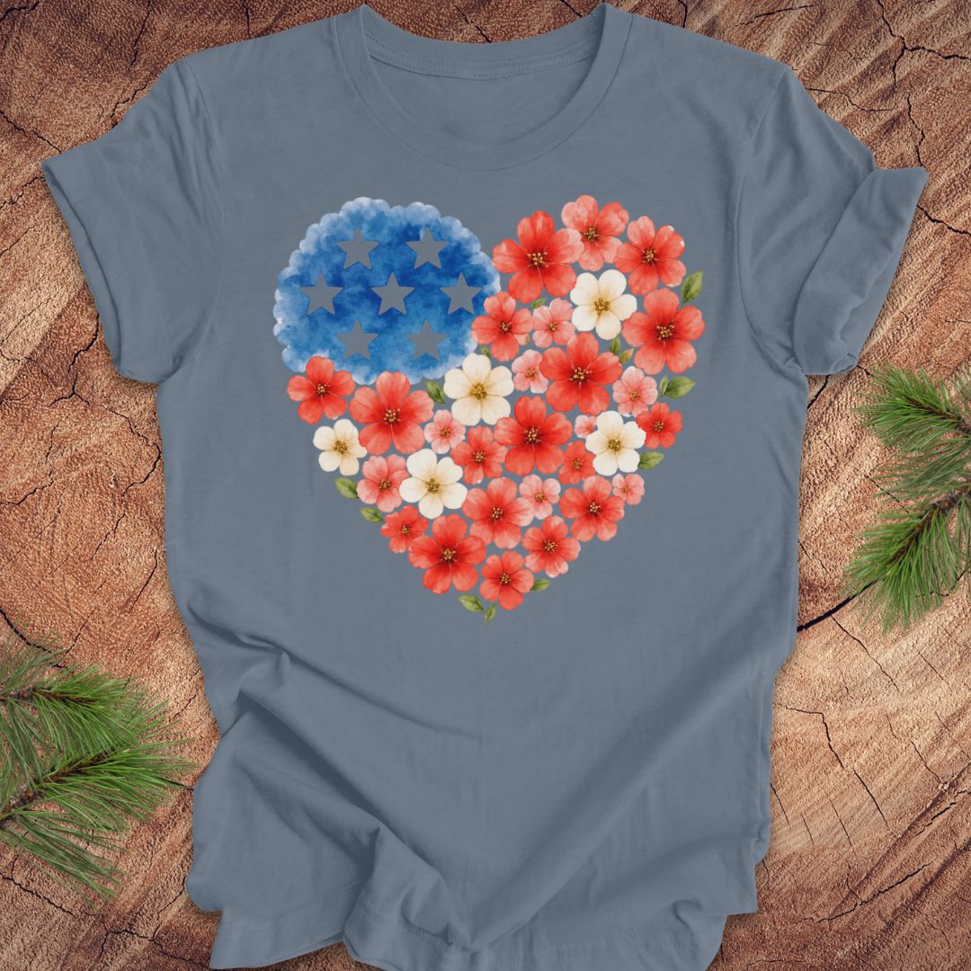 Blue t-shirt with a heart design made of flowers on a wooden surface