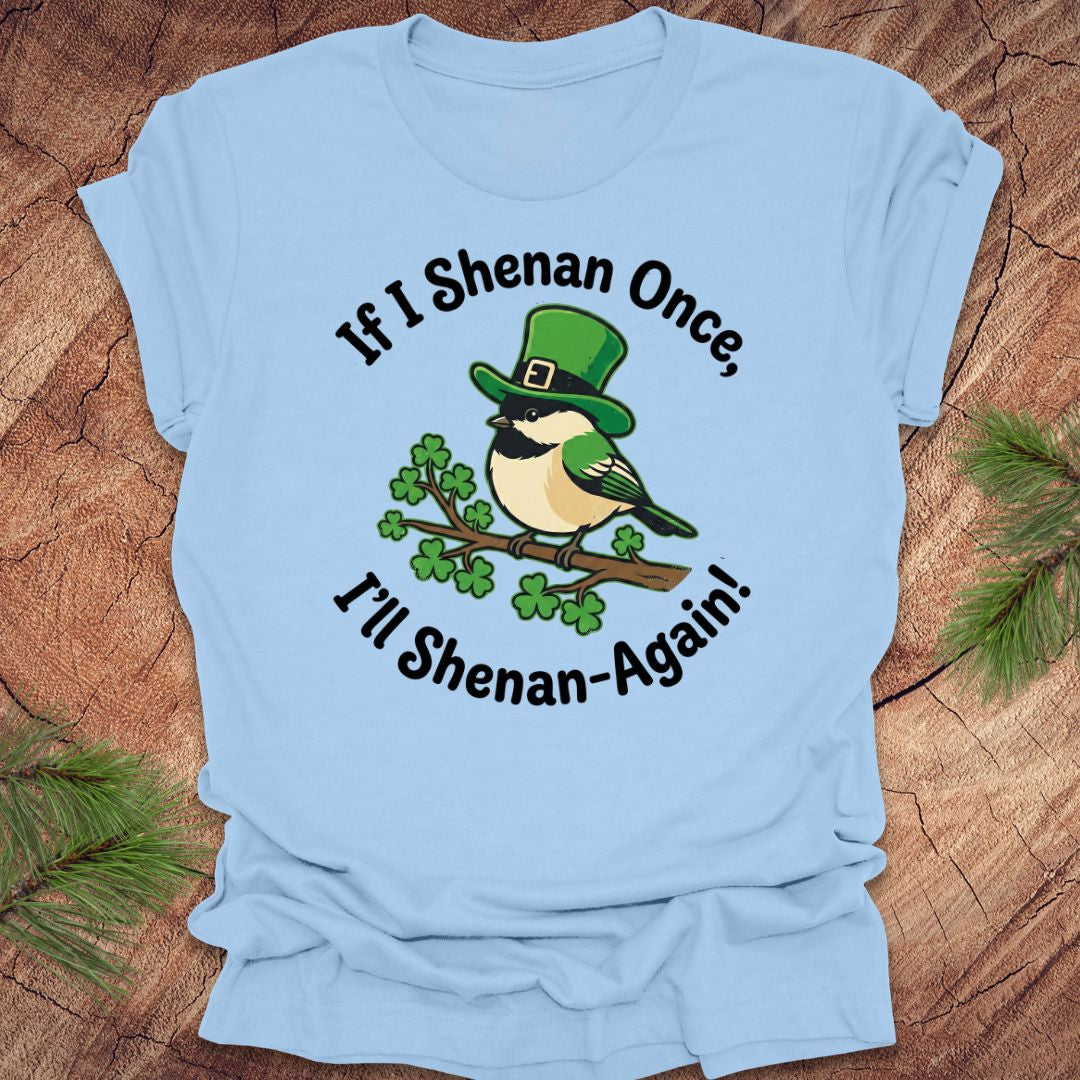 Light blue t-shirt with a st patrick's day bird graphic and text on a wooden surface