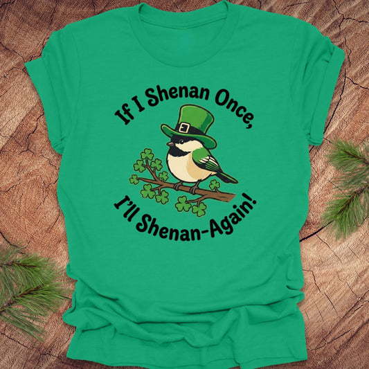 Green t-shirt with a st patrick's day bird graphic and text on a wooden surface