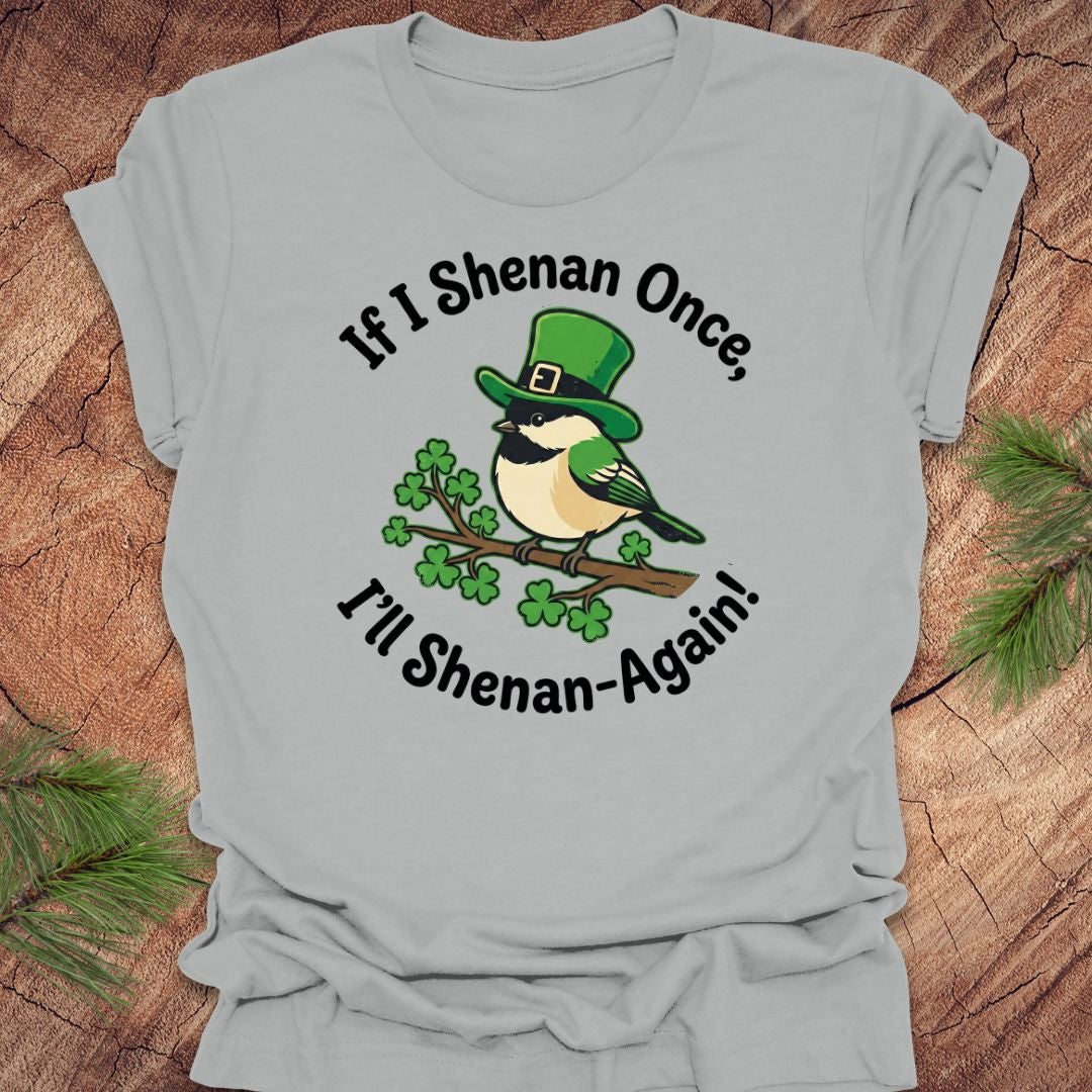 Silver t-shirt with a st patrick's day bird graphic and text on a wooden surface