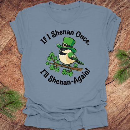 Blue t-shirt with a st patrick's day bird graphic and text on a wooden surface