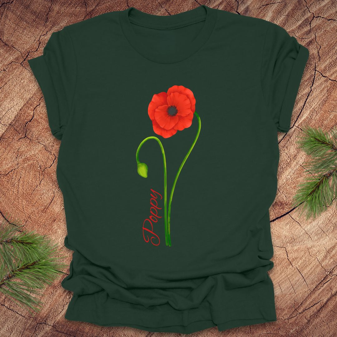 Green t-shirt with a red flower and 'Happy' text on a wooden surface