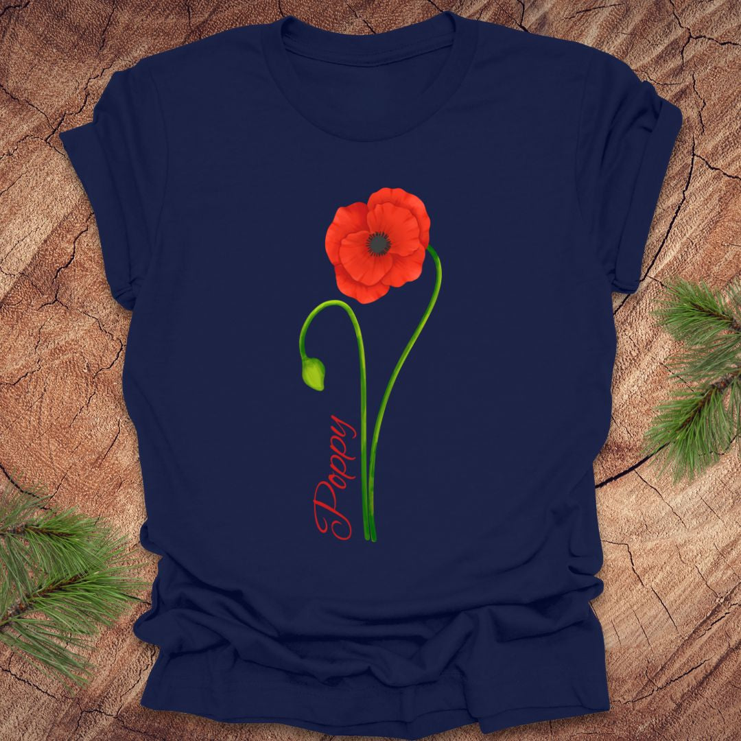 Navy blue t-shirt with a red poppy flower and 'Poppy' text on a wooden surface.