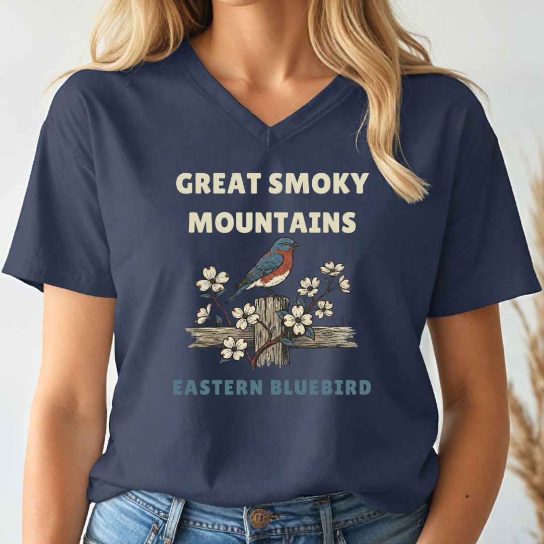 Navy blue t-shirt with 'Great Smoky Mountains' and 'Eastern Bluebird' design worn by a person.
