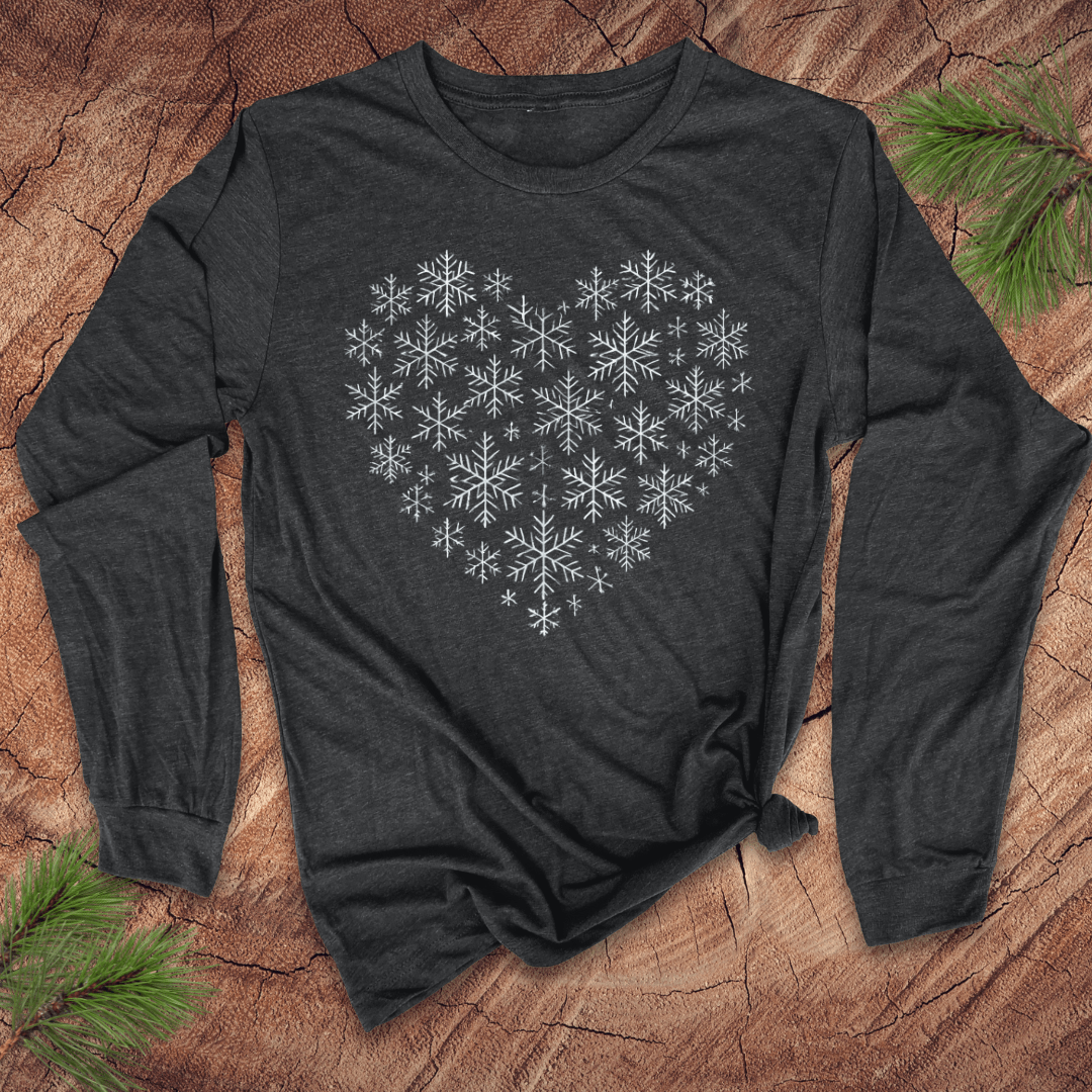 Dark grey long-sleeve t-shirt with snowflakes making the shape of a heart on a wood background.