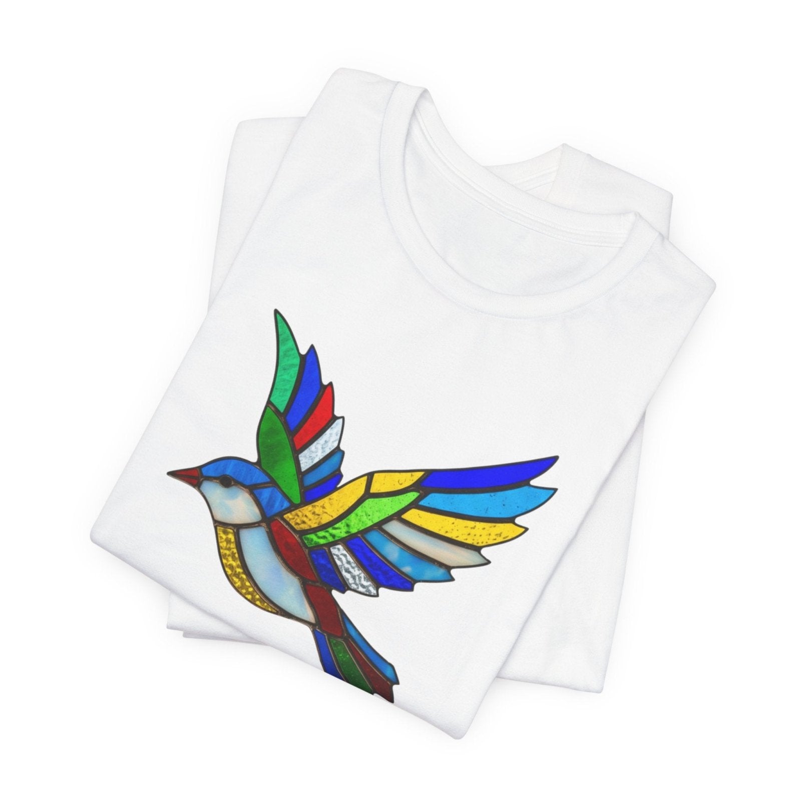 white folded tshirt with a colorful bird design on a white background