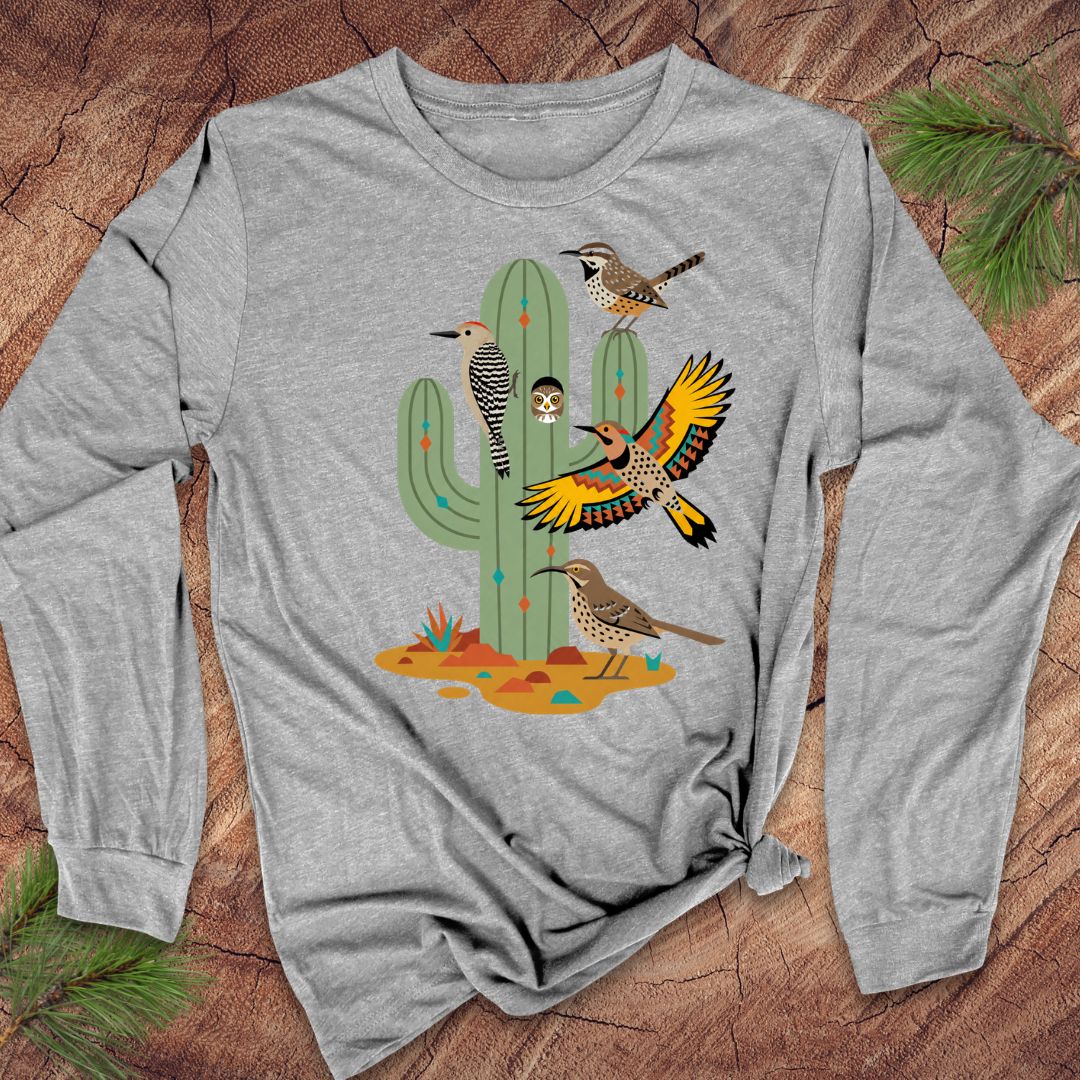 Gray long-sleeve t-shirt with birds and a cactus on a wood background.