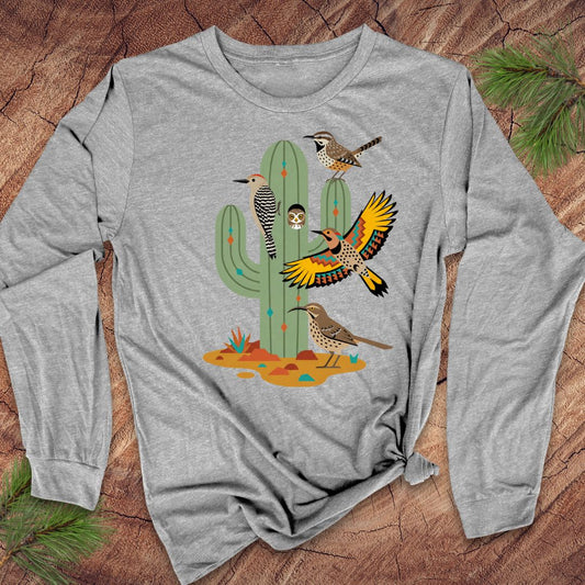 Gray long-sleeve t-shirt with birds and a cactus on a wood background.