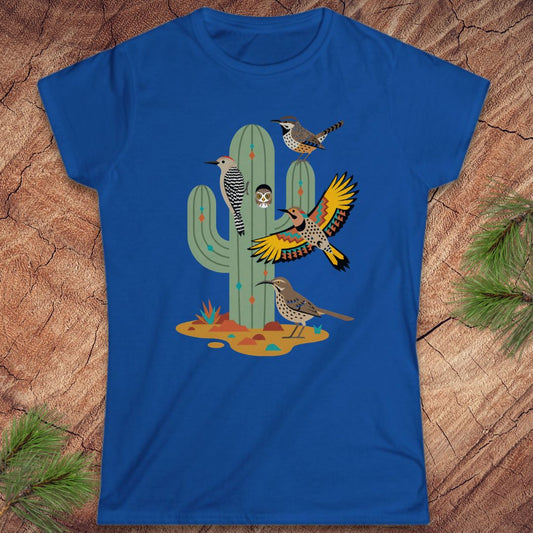 Blue t-shirt with a cactus and birds on a wood background.