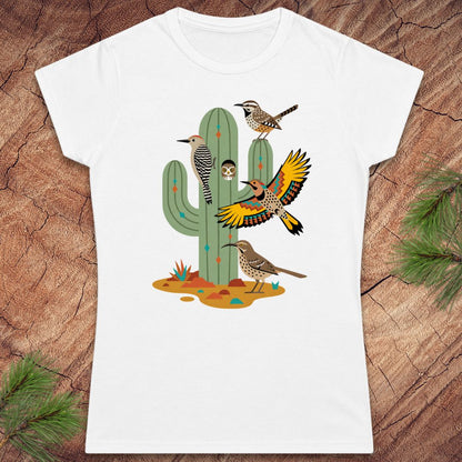 White t-shirt with a cactus and birds on a wood background.