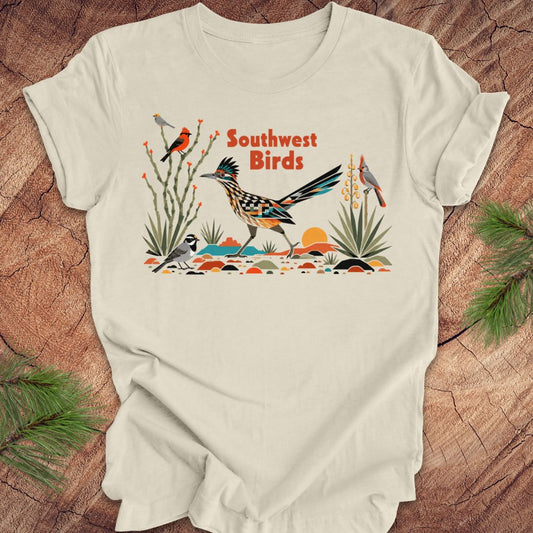 Beige t-shirt with 'Southwest Birds' design on a wooden surface