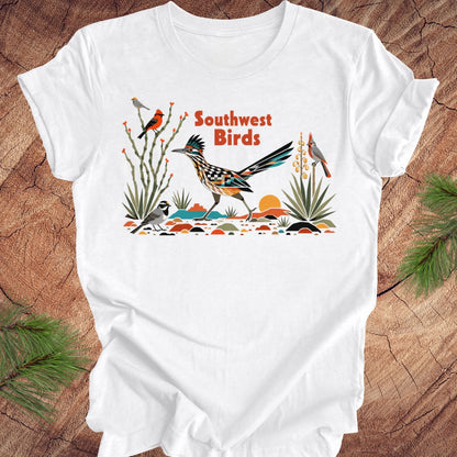 White t-shirt with 'Southwest Birds' design on a wooden surface
