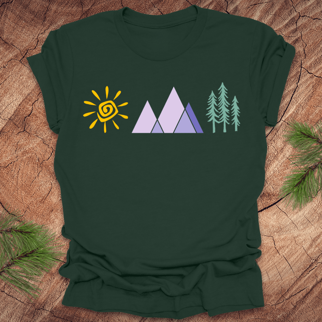 Forest green t-shirt with nature-themed design on a wooden surface