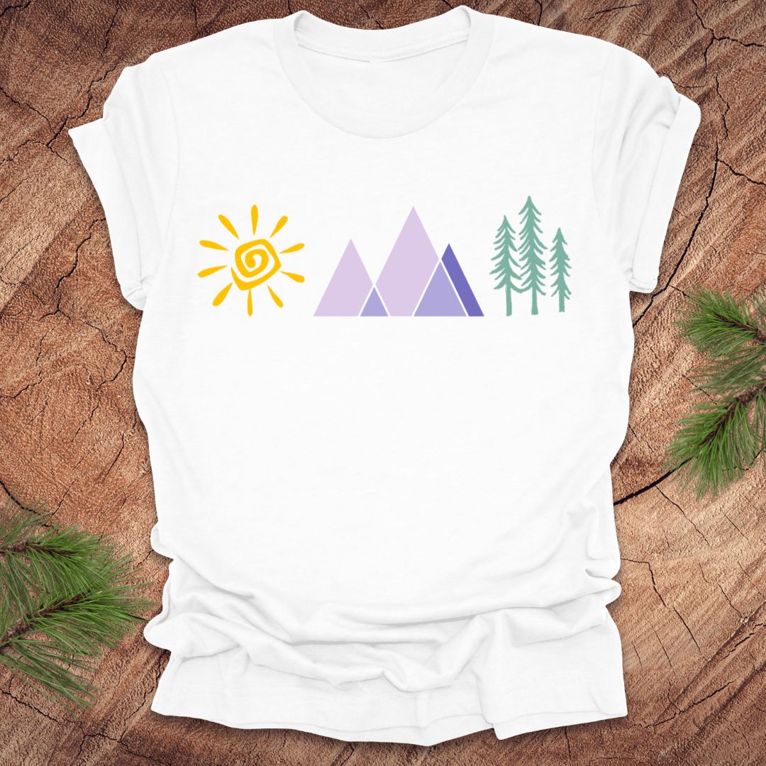 White t-shirt with nature-themed graphics on a wooden surface