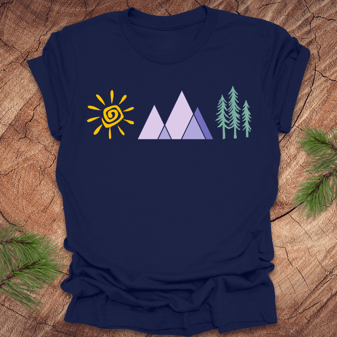 Navy blue t-shirt with a sun, mountain, and tree graphic on a wooden surface.