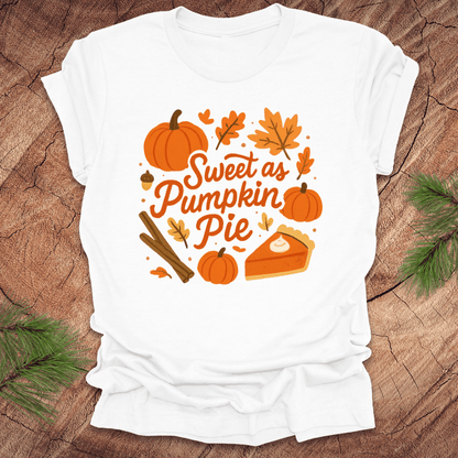 White t-shirt with 'Sweet as Pumpkin Pie' design on a wooden surface
