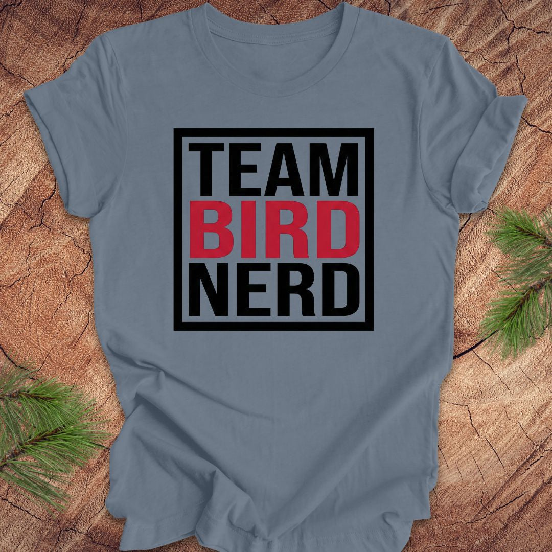 Steel blue t-shirt with 'Team Bird Nerd' text on a wooden surface