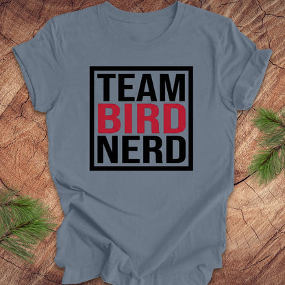 Steel blue t-shirt with 'Team Bird Nerd' text on a wooden surface