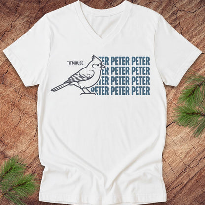 White vneck t-shirt with blue "Peter" text and titmouse illustration on a wooden surface