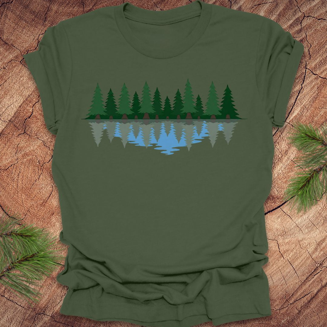 Green t-shirt with a nature graphic on a wooden surface